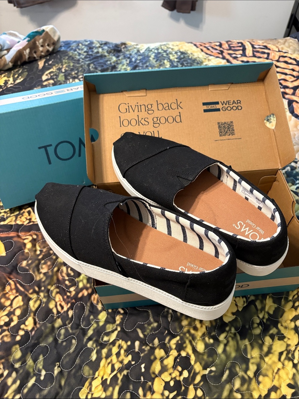 TOMS Women’s Black Slip-On Moccasins with Striped Lining